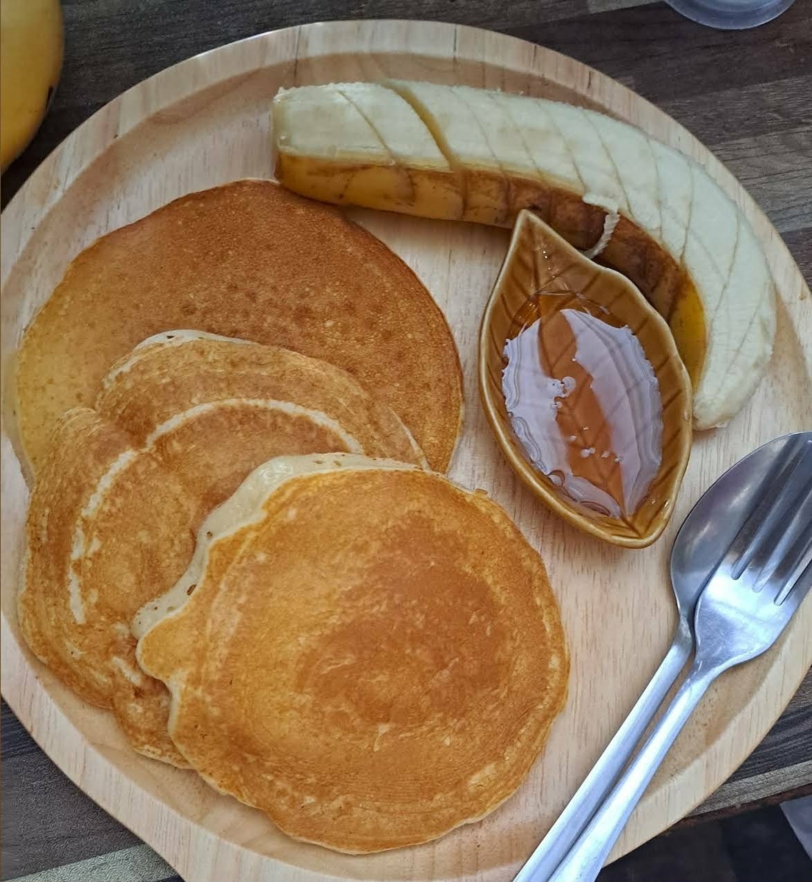 Banana pancakes with local honey, served for breakfast