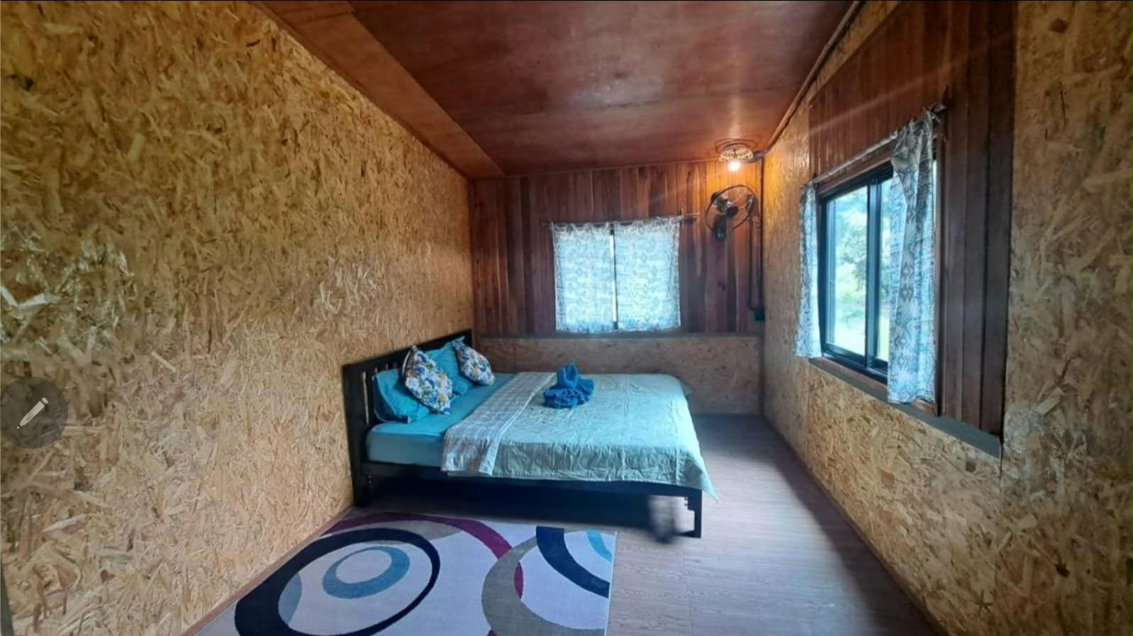 Deluxe Room with a double bed and garden-facing windows